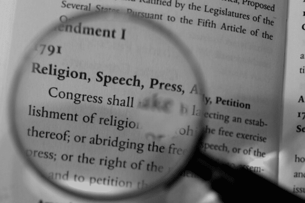 magnifying glass above Amendment text
